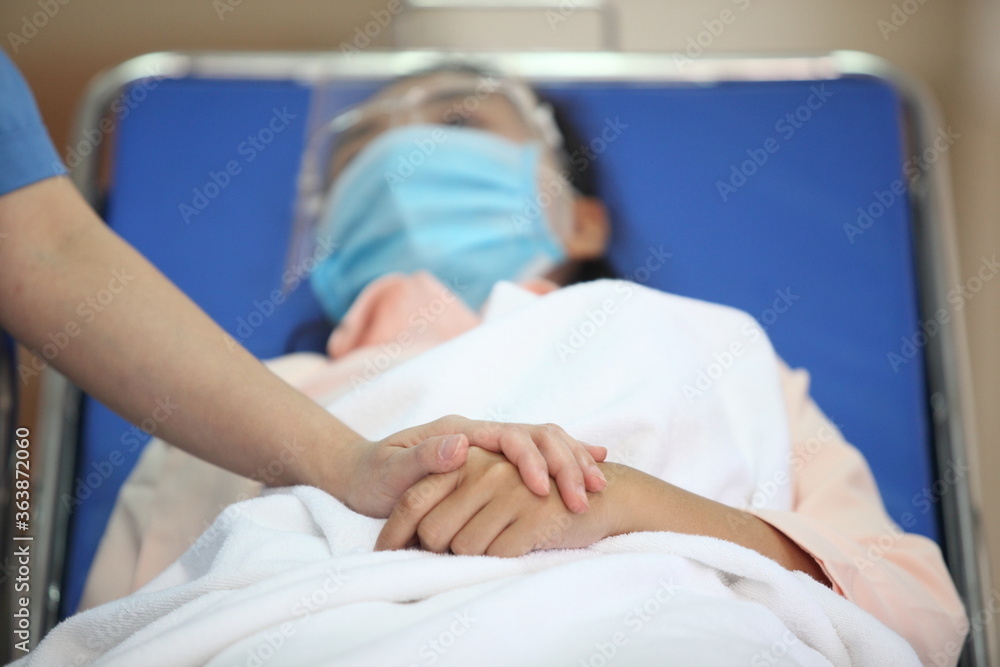 Doctor and patient wearing facemasks during coronavirus and flu outbreak. Virus and illness protection, home quarantine. COVID-2019 Doctor and patient wearing facemasks during coronavirus and flu outbreak. Virus and illness protection, home quarantine. COVID-2019
