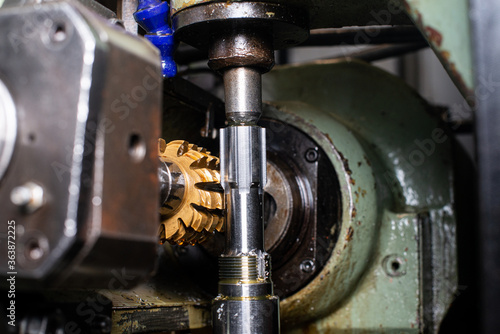 gear cutting machine close up. production of metal parts.