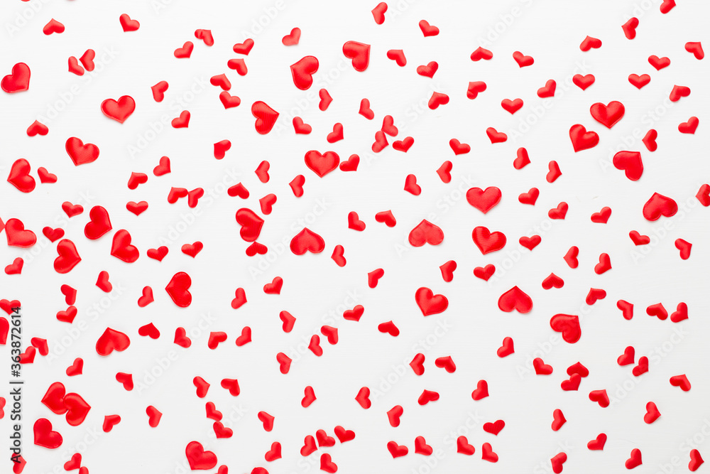 Valentines day background red hearts on wooden background.