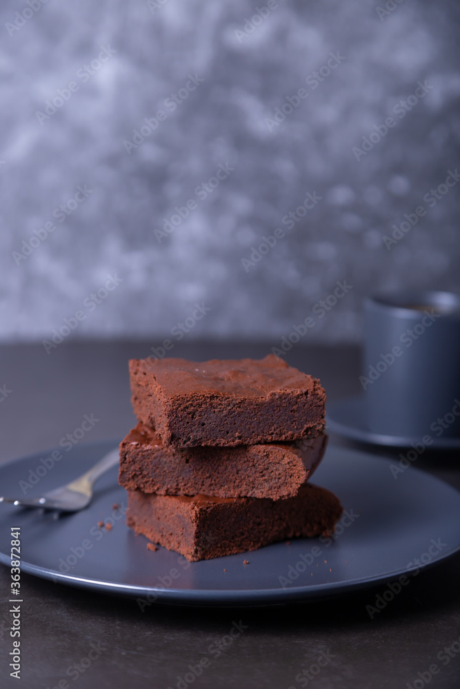 Brownie cake. Homemade Chocolate Dessert. A popular dark chocolate cake. Close-up, place for text. Brownie cake. Homemade Chocolate Dessert. A popular dark chocolate cake. Close-up, place for text.