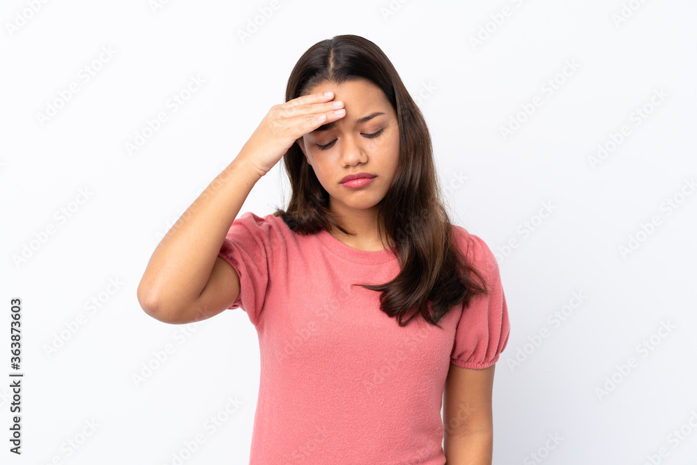 Young Colombian girl over isolated white background with tired and sick expression Young Colombian girl over isolated white background with tired and sick expression