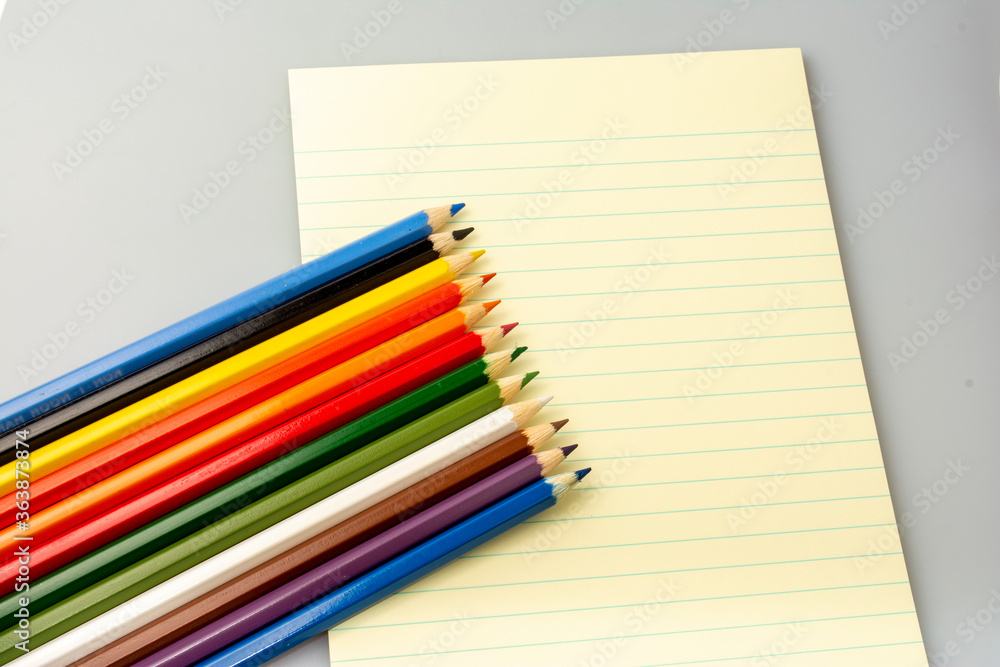 colored pencils and notebook colored pencils and notebook