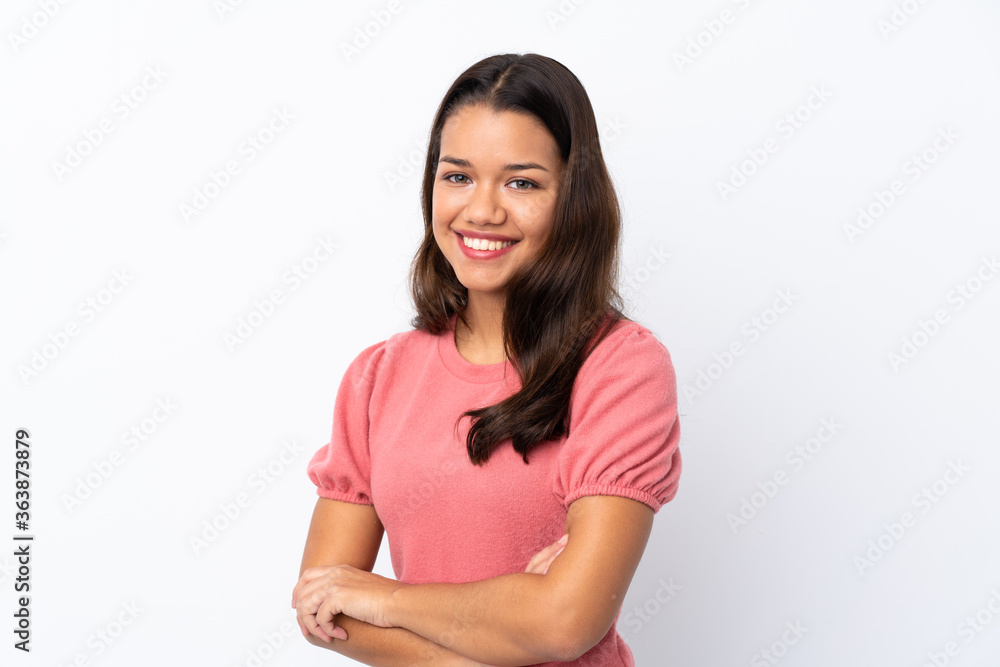Young Colombian girl over isolated white background with arms crossed and looking forward Young Colombian girl over isolated white background with arms crossed and looking forward