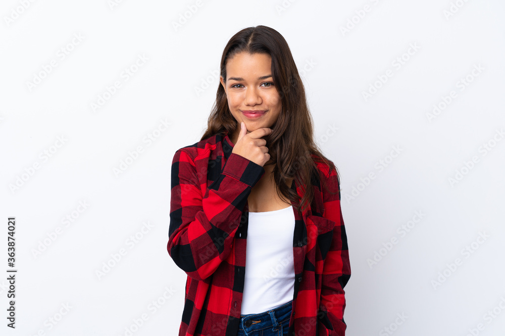 Young Colombian girl over isolated white background laughing