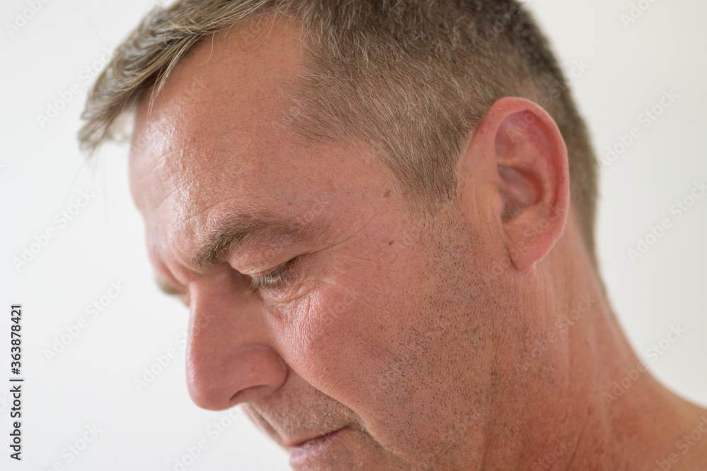 Close up cropped side profile of a middle-aged man Close up cropped side profile of a middle-aged man