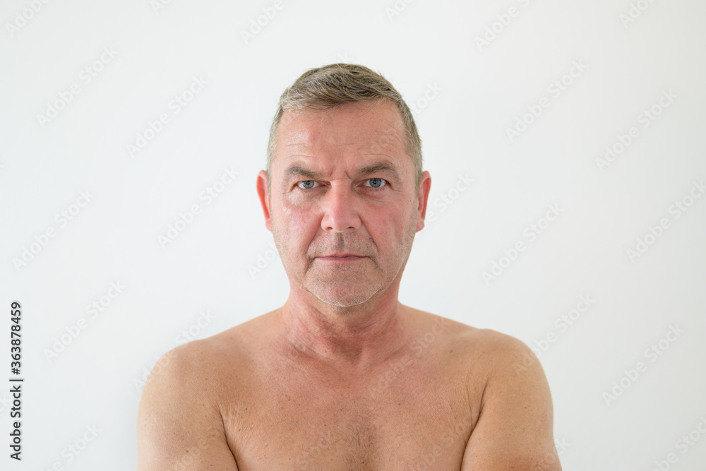Fototapeta premium Serious middle-aged man posing shirtless