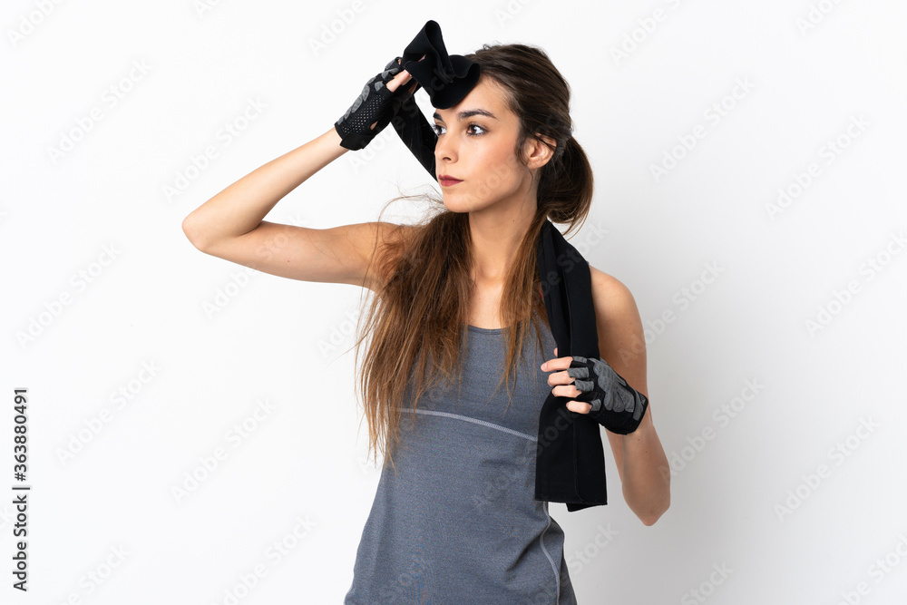 Young caucasian woman isolated on white background with sport towel Young caucasian woman isolated on white background with sport towel