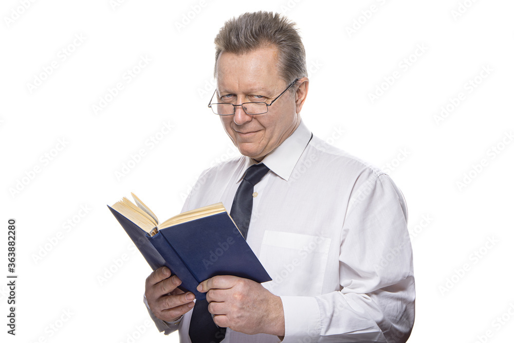 Closeup portrait of senior elderly teacher with glasses holding book, isolated on white background. Education concept Closeup portrait of senior elderly teacher with glasses holding book, isolated on white background. Education concept