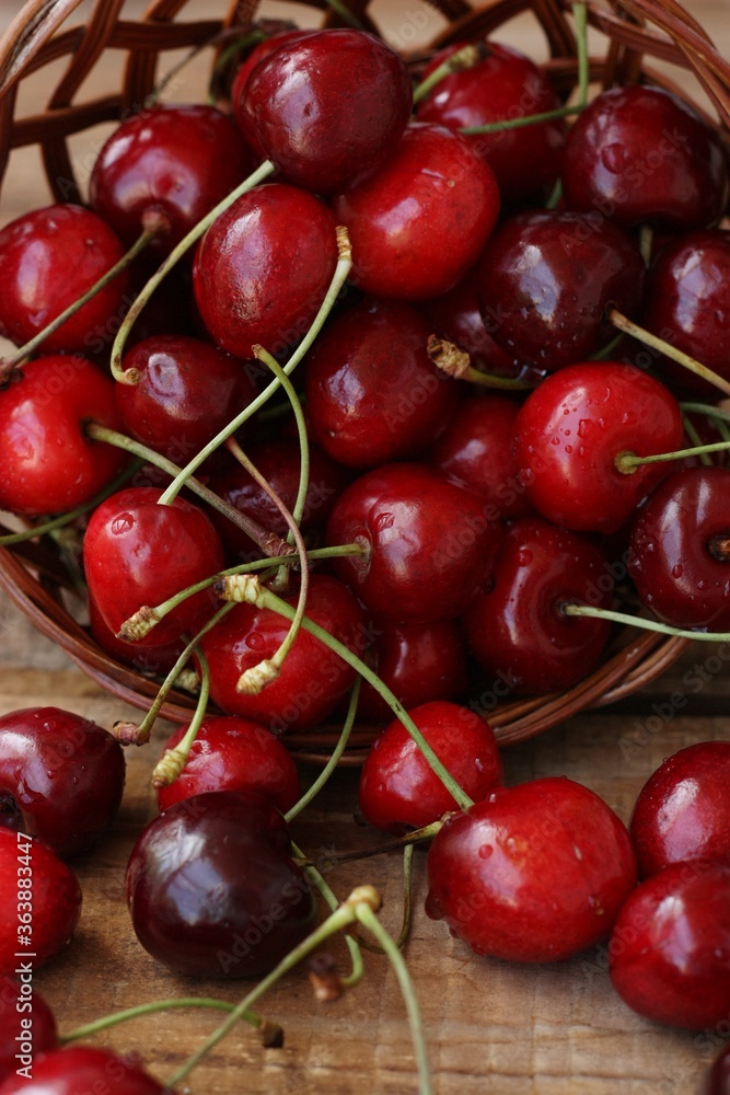 Ripe red cherries on a wooden table Ripe red cherries on a wooden table