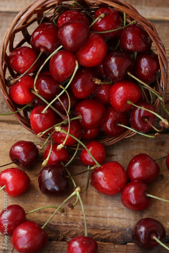 Ripe red cherries on a wooden table Ripe red cherries on a wooden table