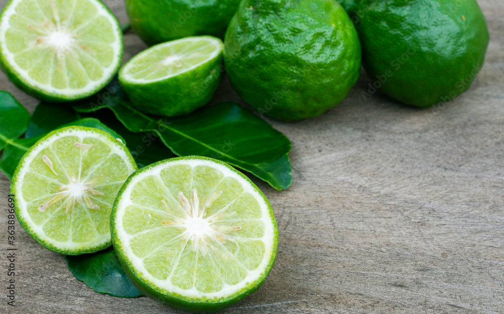 Fresh bergamot and green leaf on wooden background. Fresh bergamot and green leaf on wooden background.