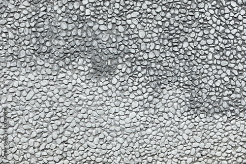 Many gray pebble stones as a background texture header