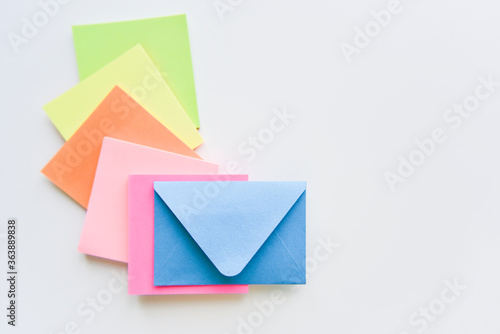 selective focus, blue envelope in the center with colored rectangles spreading under it