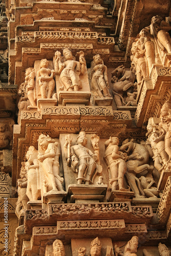 Close up of artful carved walls, Ancient reliefs at famous erotic temple in Khajuraho, Madhya Pradesh, India. © artqu