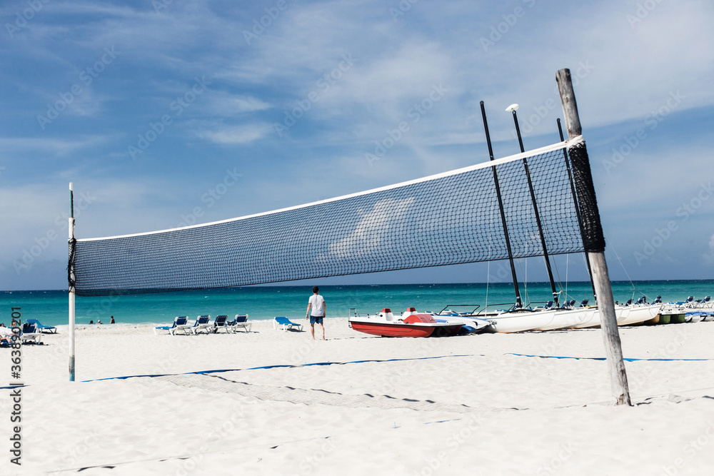 Beautiful beach with white sand, turquoise ocean water and blue sky with clouds in sunny day. Panoramic view. Natural background for summer vacation. Beautiful beach with white sand, turquoise ocean water and blue sky with clouds in sunny day. Panoramic view. Natural background for summer vacation.