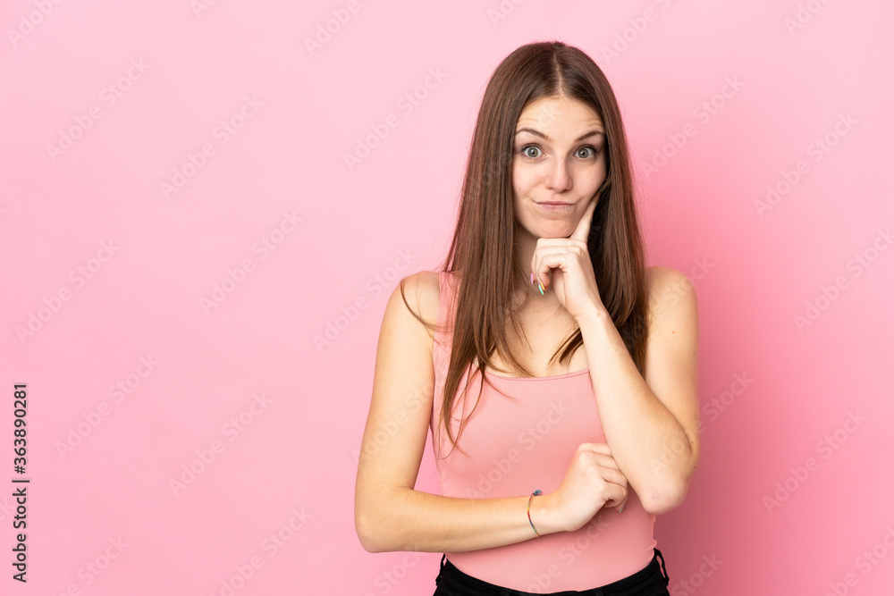 Young caucasian woman isolated on pink background and thinking Young caucasian woman isolated on pink background and thinking