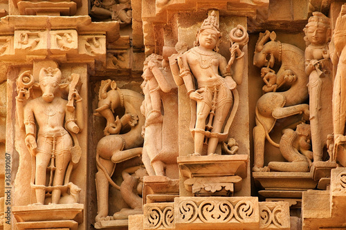 Close up of artful carved walls, Ancient reliefs at famous erotic temple in Khajuraho, Madhya Pradesh, India. photo
