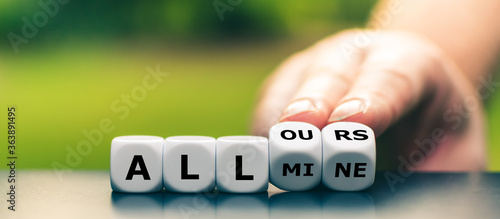 Photography Hand turns dice and changes the expression all mine to all ours