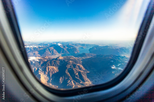 The view from the airplane window on a picturesque mountains landscape