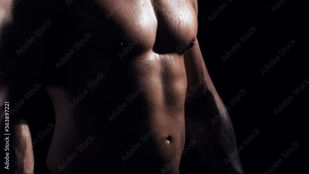 Fit and sporty bodybuilder over black background. Bodybuilder in studio. Sport and fitness. Fit and sporty bodybuilder over black background. Bodybuilder in studio. Sport and fitness.