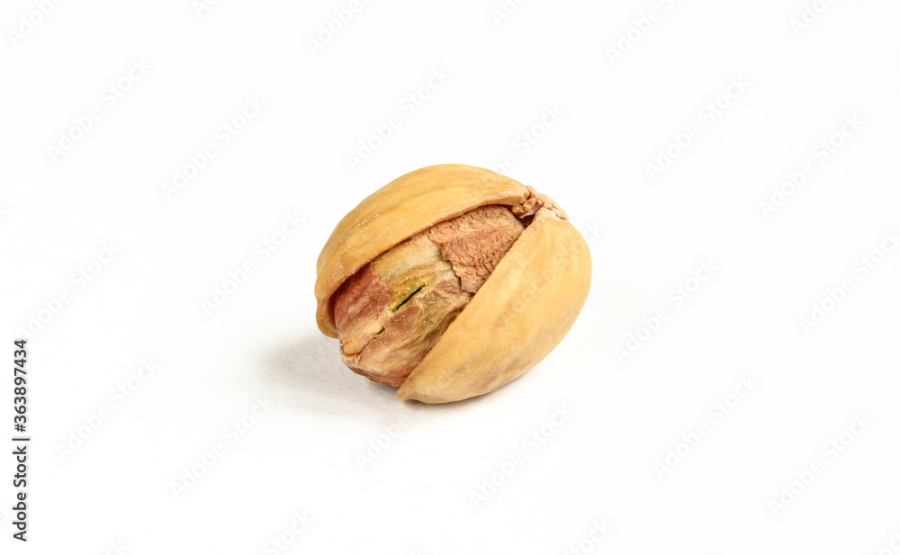 Single pistachio food in shell isolated on white background. Single pistachio food in shell isolated on white background.
