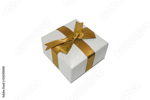 Gift box with gold ribbon isolated on white background. Small Jewelry/holiday box macro