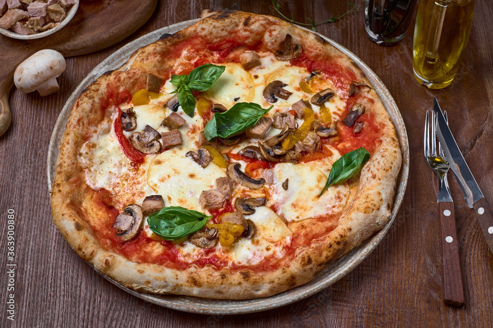 Pizza Turkey breast, mushrooms and mozzarella, smoked papillon cheese on black concrete background. Pizza Turkey breast, mushrooms and mozzarella, smoked papillon cheese on black concrete background.
