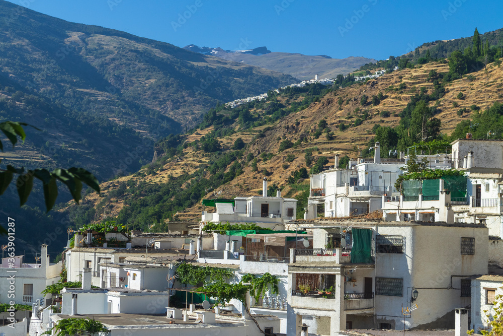 white villages on the side of a mountain