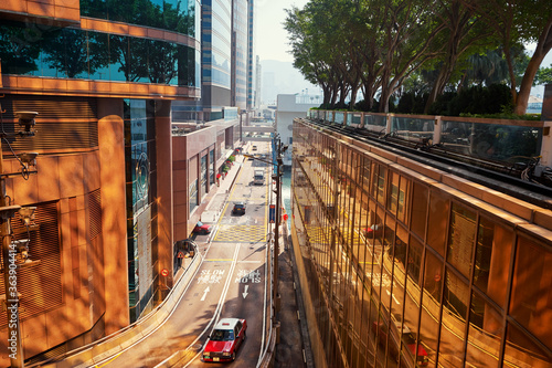Photography Red cab taxi in a street downtown in Central Hong Kong