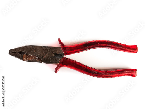 Old pliers, red handle On a white background photo