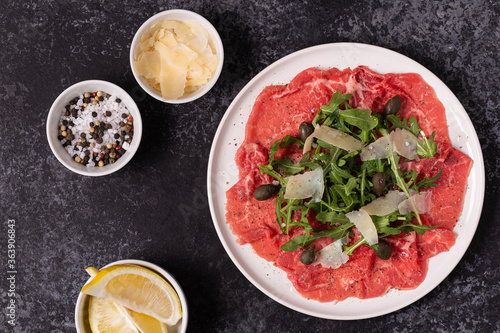 Marbled beef carpaccio with arugula, capers and parmesan cheese