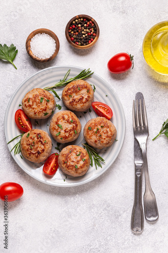 Fresh chiken cutlets with tomatoes and rosemary