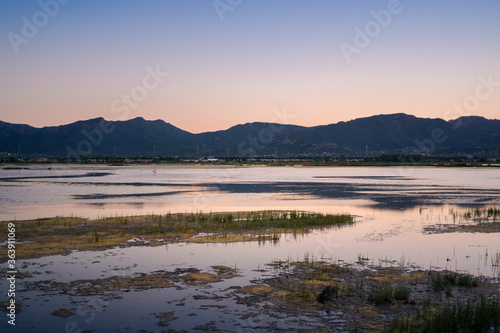 Reflections of the sunset on the pond