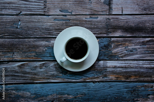  Coffee cup on a blue old wooden background
