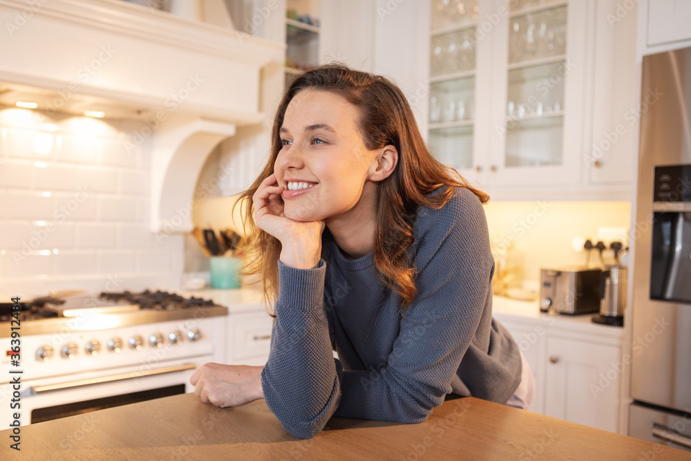 Woman smiling in the kitchen