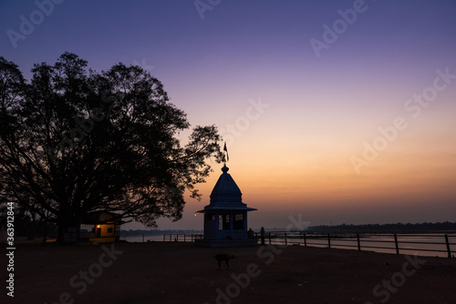 Dusk time at Cheepaner Ghat with holy Narmada river and temple, Madhya Pradesh, India.