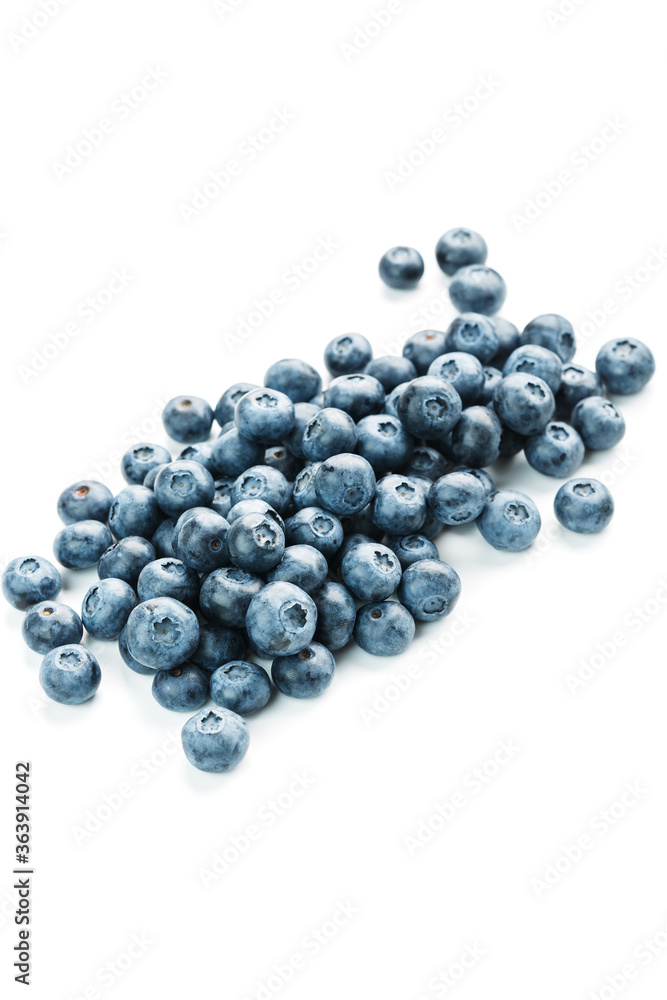 Blueberries isolated on a white background. A scattering of ripe, juicy, delicious and healthy berries. Blueberries isolated on a white background. A scattering of ripe, juicy, delicious and healthy berries.