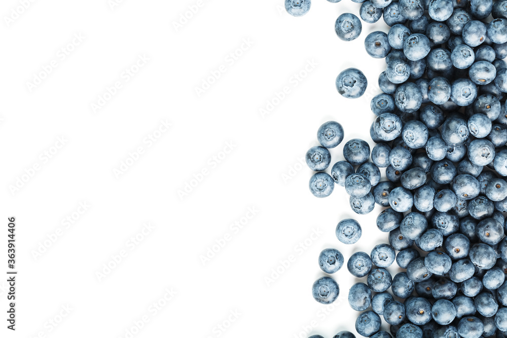 Blueberries are scattered on a white background. Free space, isolate. Studio light. Blueberries are scattered on a white background. Free space, isolate. Studio light.
