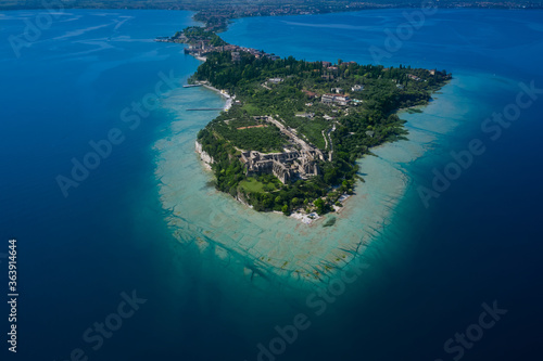 A look at the entire Sirmione Peninsula side of the Archaeological site of Grotte di Catullo. Garda lake, Sirmione, Italy. © Berg