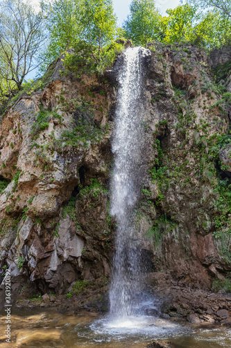 View of the water falling from above on Honey waterfalls