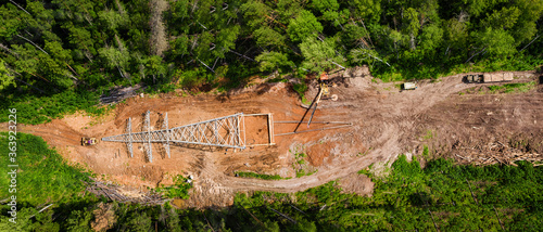 Construction of power lines in the forest