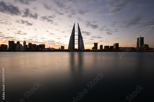 Bahrain skyline during sunrise. A long exposure image showing the streaks of clouds