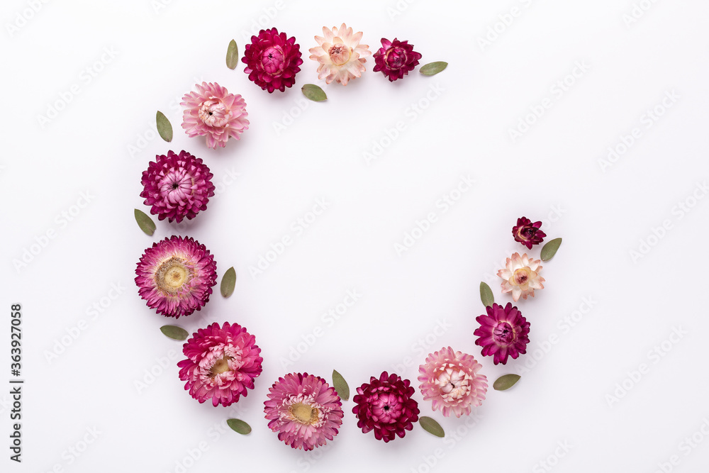 Flower composition. Frame made of dry flowers on white background. Flat lay. Top view. Copy space. Square Flower composition. Frame made of dry flowers on white background. Flat lay. Top view. Copy space. Square