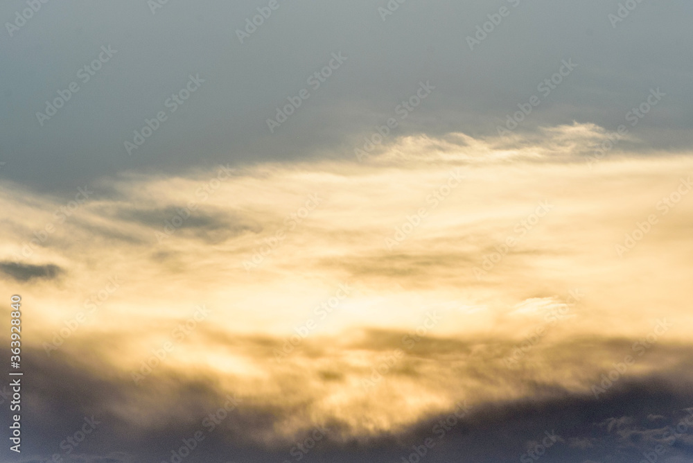 Obraz premium Dramatic orange sky with clouds at sunset