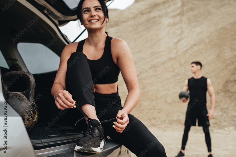 Obraz premium Two Athletes Wearing Black Sportswear Open Air, Healthy Lifestyle and Outdoors Training Concept