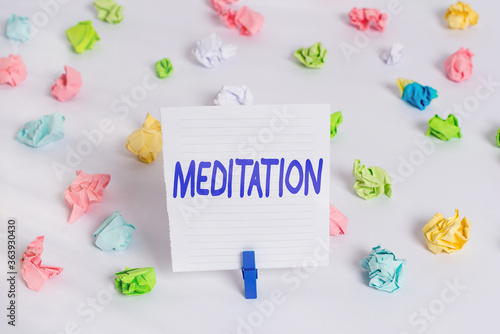 Word writing text Meditation. Business photo showcasing achieve a mentally clear and emotionally calm and stable state Colored crumpled papers empty reminder white floor background clothespin