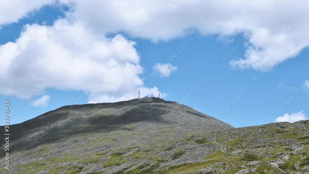 Landscape time lapse of clouds over Mount Washington in summer.
