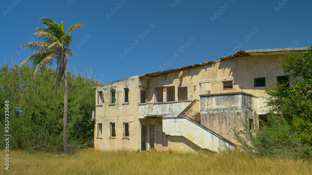 Old abandoned hotel crumbles down in the rugged tropical elements on Barbados.