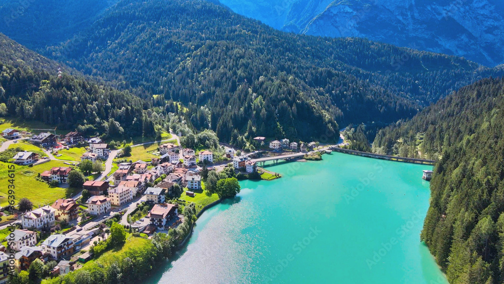 Alpin lake and dam in summertime, view from drone, Auronzo, italian dolomites