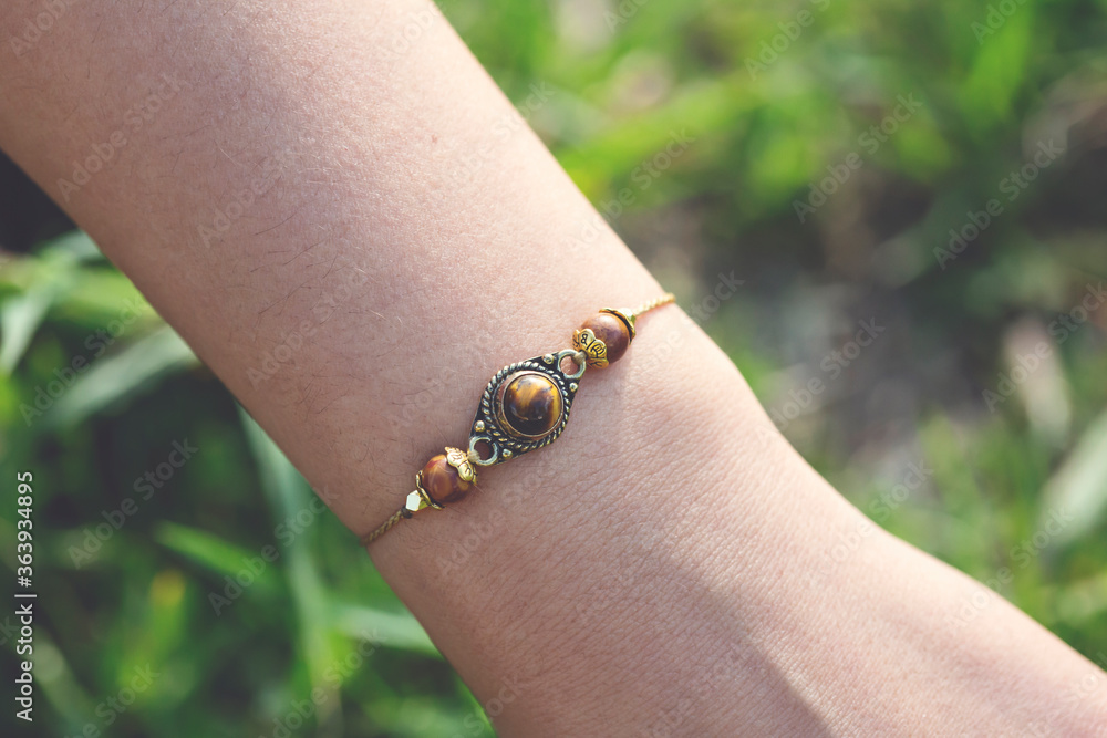 Tiger eye mineral stone beads tiny elegant bracelet on female wrist